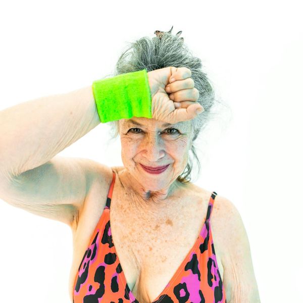 Woman smiling feeling energetic and balanced after exercise.